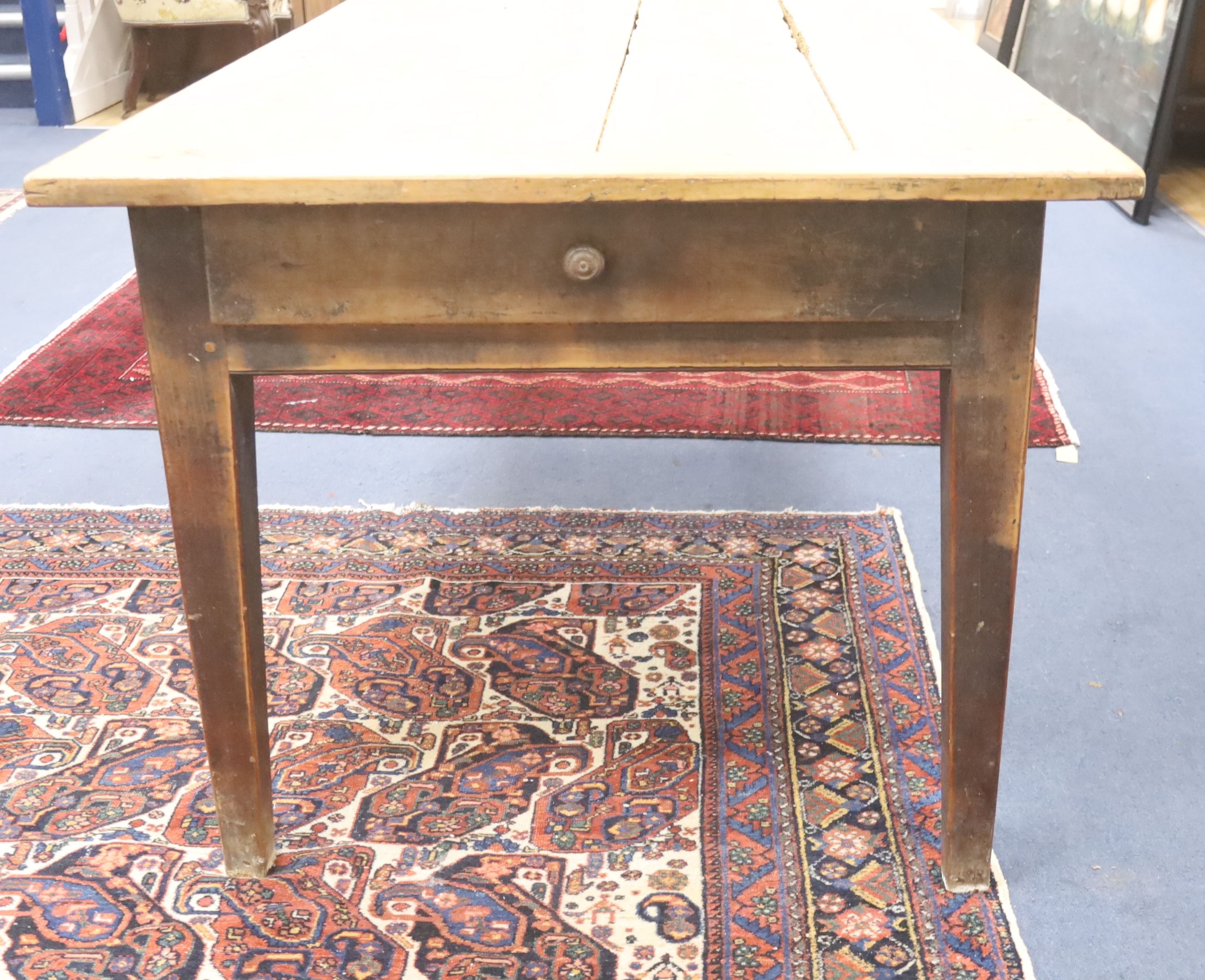 A 19th century French fruitwood kitchen table, length 192cm, depth 92cm, height 74cm